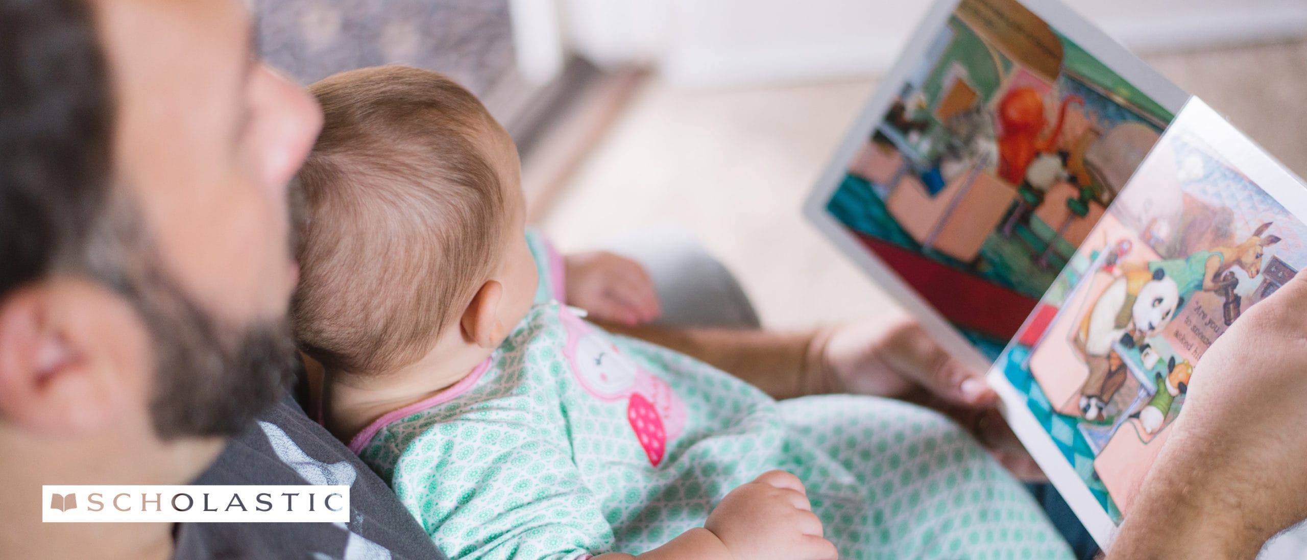 Father reading book to baby